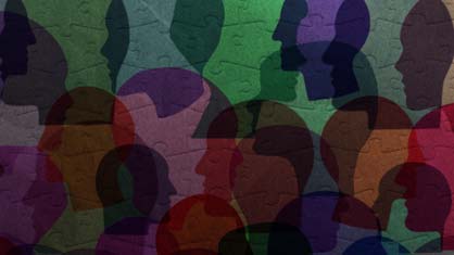 montage of human head silhouettes over jigsaw puzzle