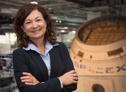 Nancy Dandridge graduated with a master's in Information Systems from Northwestern University and poses at SpaceX where she works.