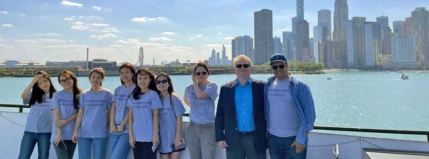 students at lakeshore with Chicago skyline in background