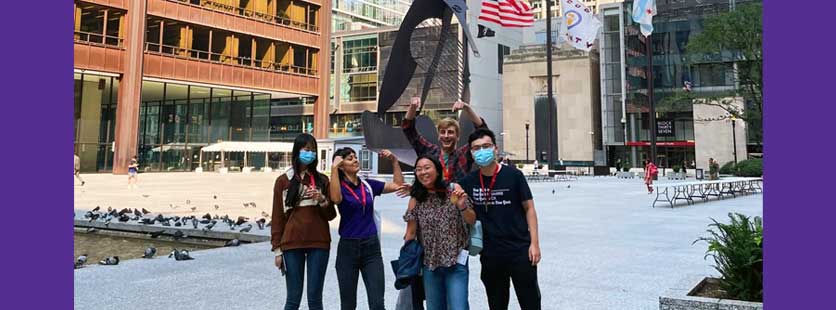 students in front of Picasso sculpture