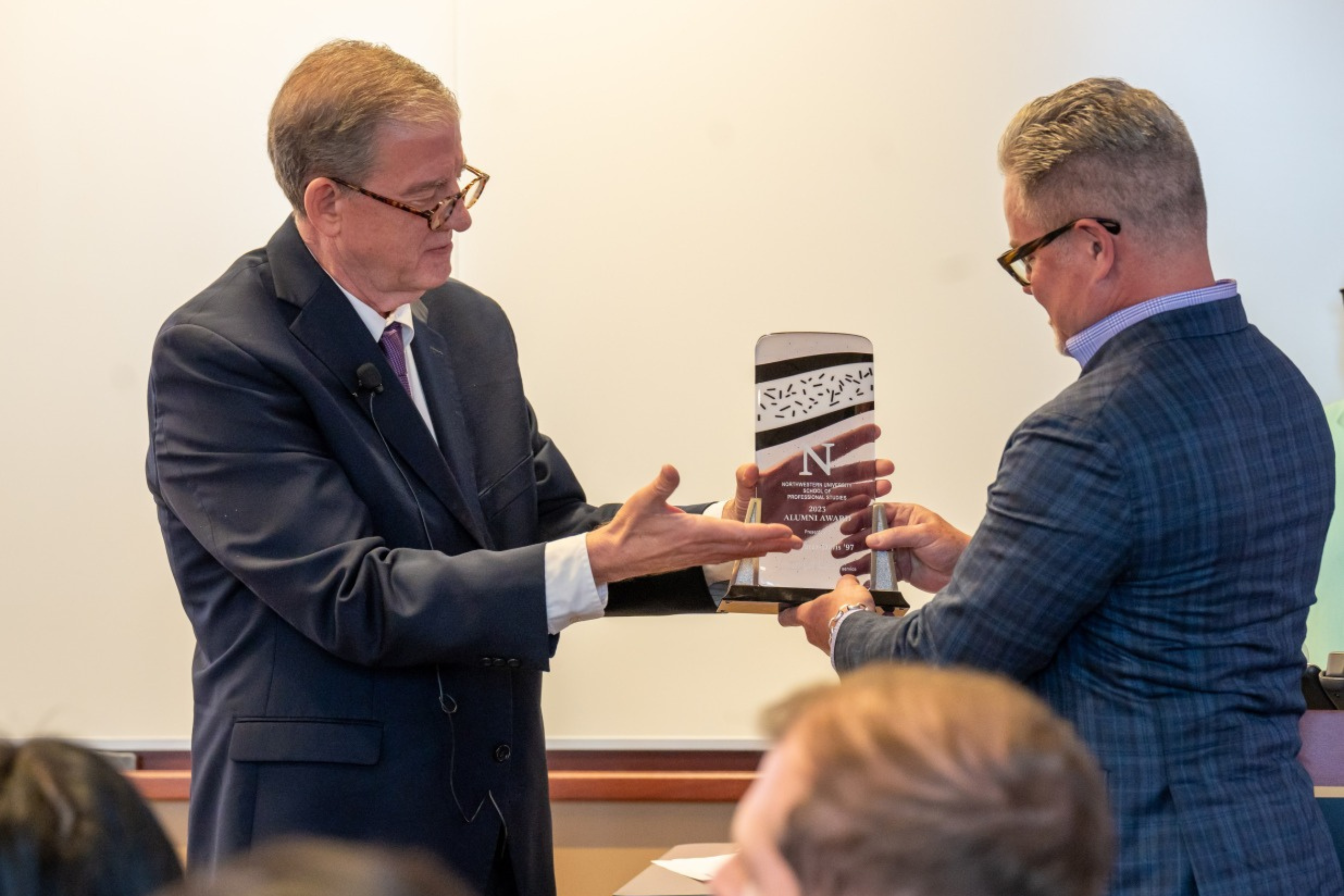 Jon Suarez-Davis '97 (right) was presented with the award by SPS Dean Tom Gibbons, as part of the closing keynote during the 2023 SPS Symposium.  Photo: Joseph Yun.