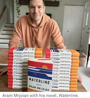 Aram Mrjoian with his book, Waterline